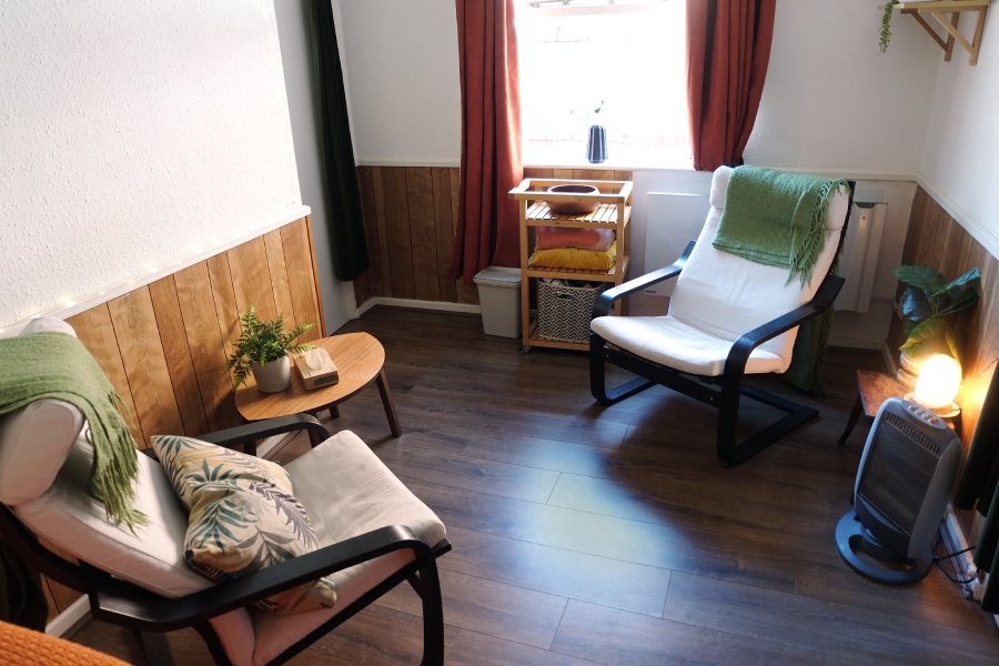 Calm psychotherapy room with two chairs for counselling sessions focused on anxiety, trauma, and emotional support in Birmingham