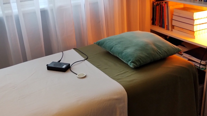 Massage table prepared for somatic therapy and stress relief treatment in psychotherapy clinic